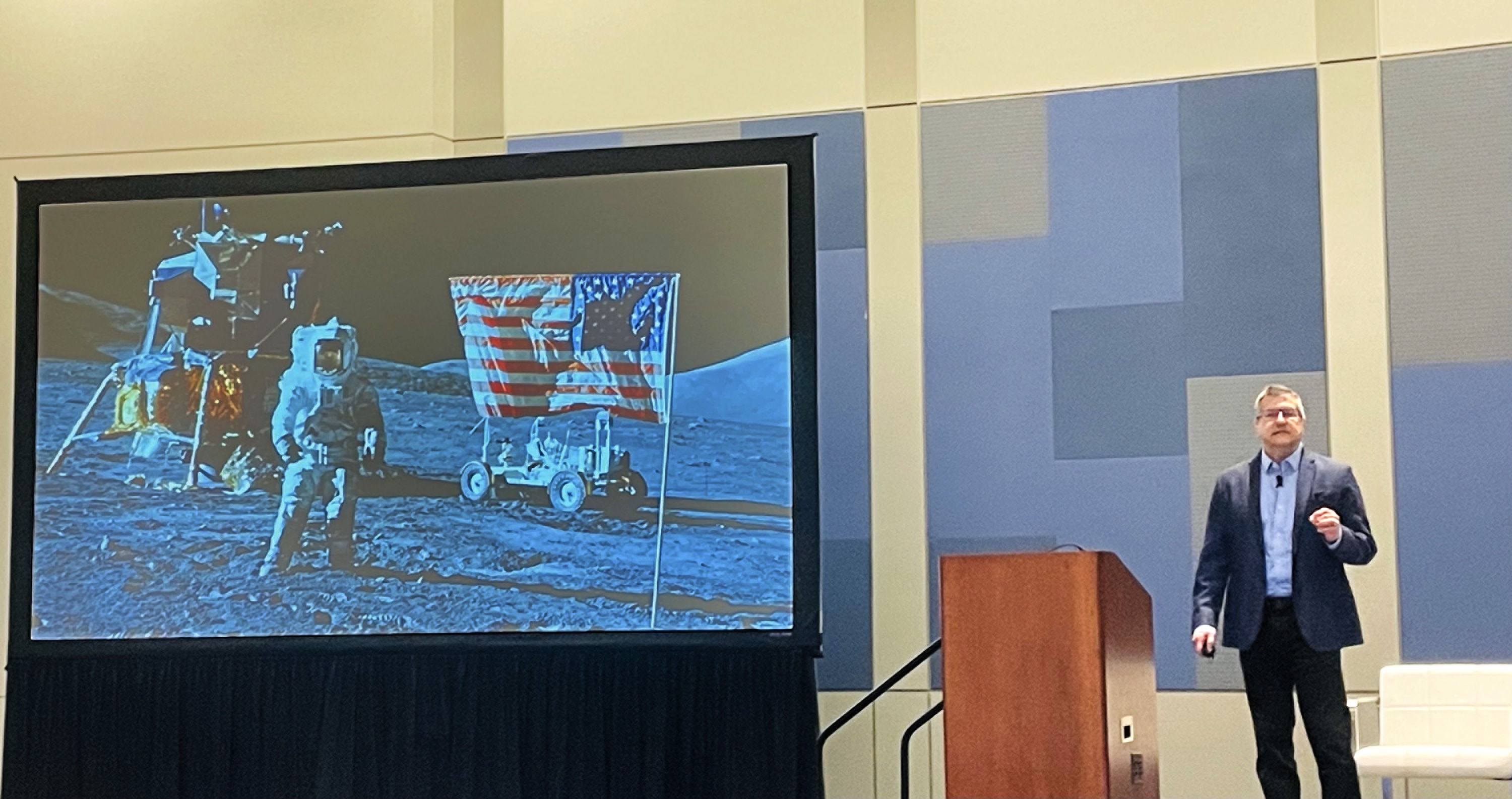 Steve Chazin presenting in front of a large screen